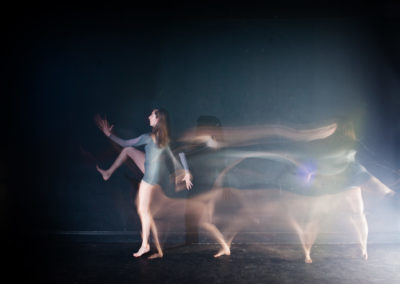 a girl in multiple moves of a dance move with strobe lighting technique